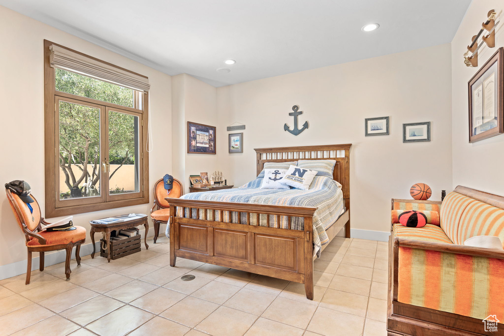 Bedroom with light tile patterned flooring and recessed lighting