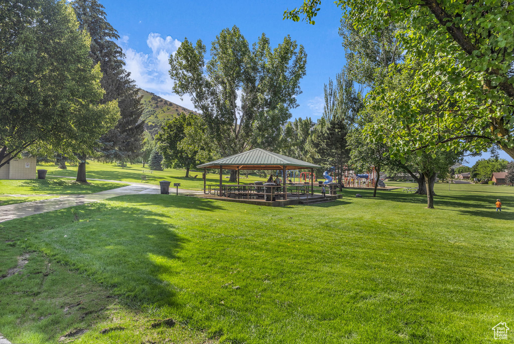 View of property\'s community with a gazebo, a lawn, and a mountain view