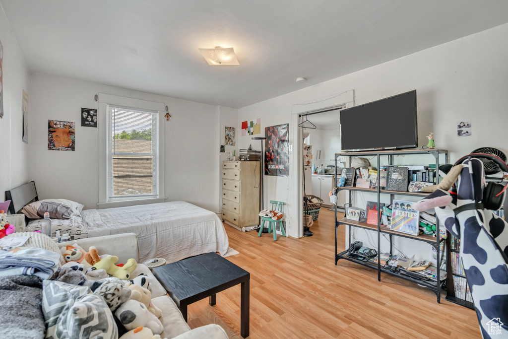 Bedroom with light wood-style floors