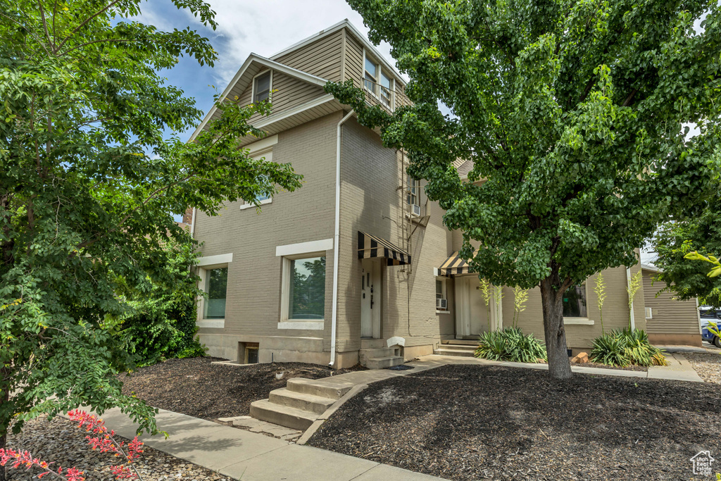 View of front of property featuring brick siding