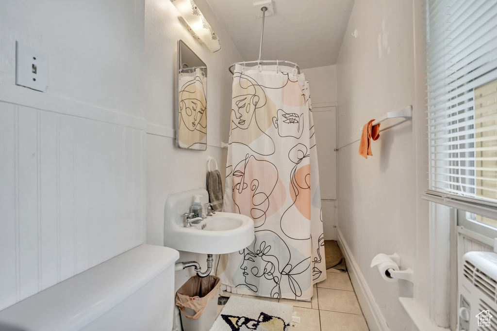 Full bath featuring tile patterned flooring and a shower with curtain