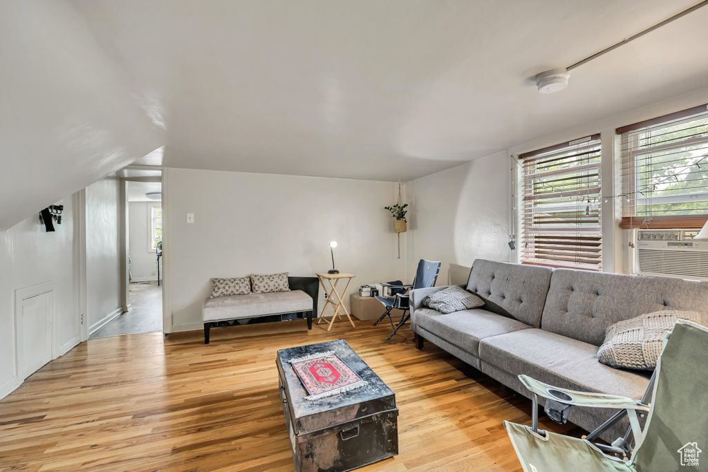 Living area featuring wood finished floors and cooling unit