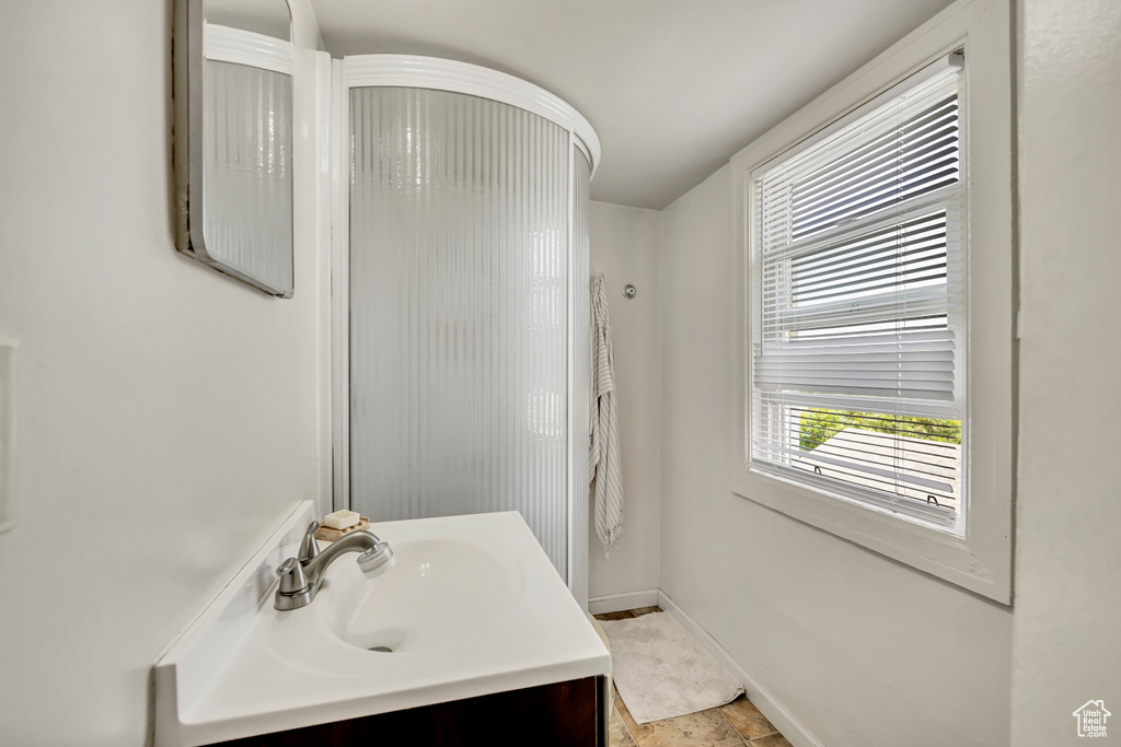 Bathroom with vanity and baseboards