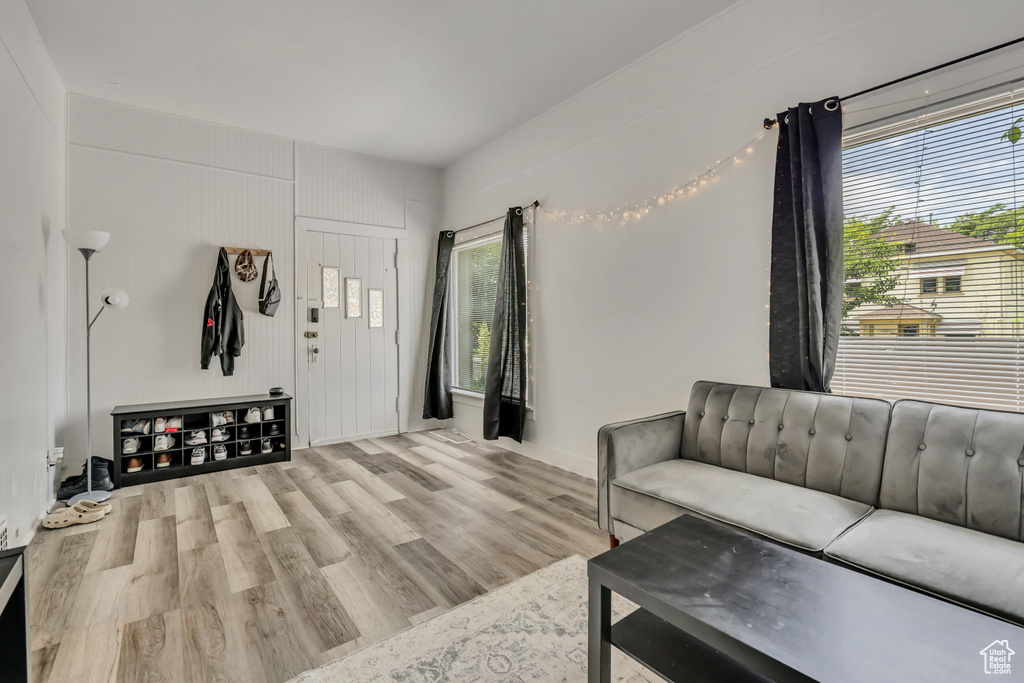 Living room with healthy amount of natural light and wood finished floors