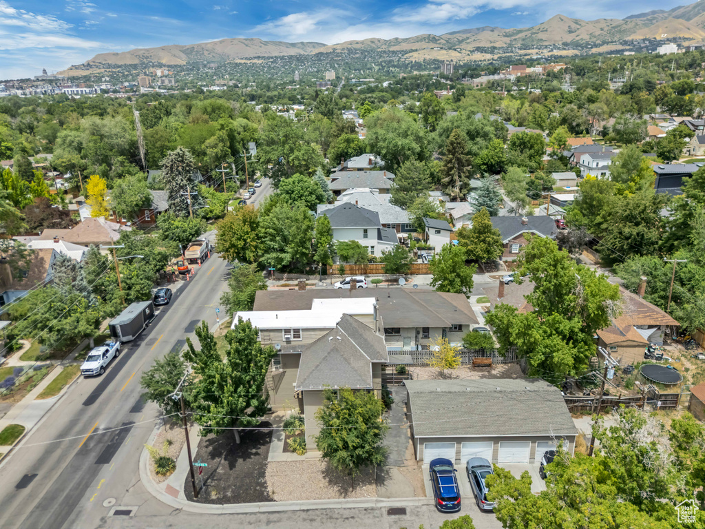Aerial perspective of suburban area featuring a mountain backdrop
