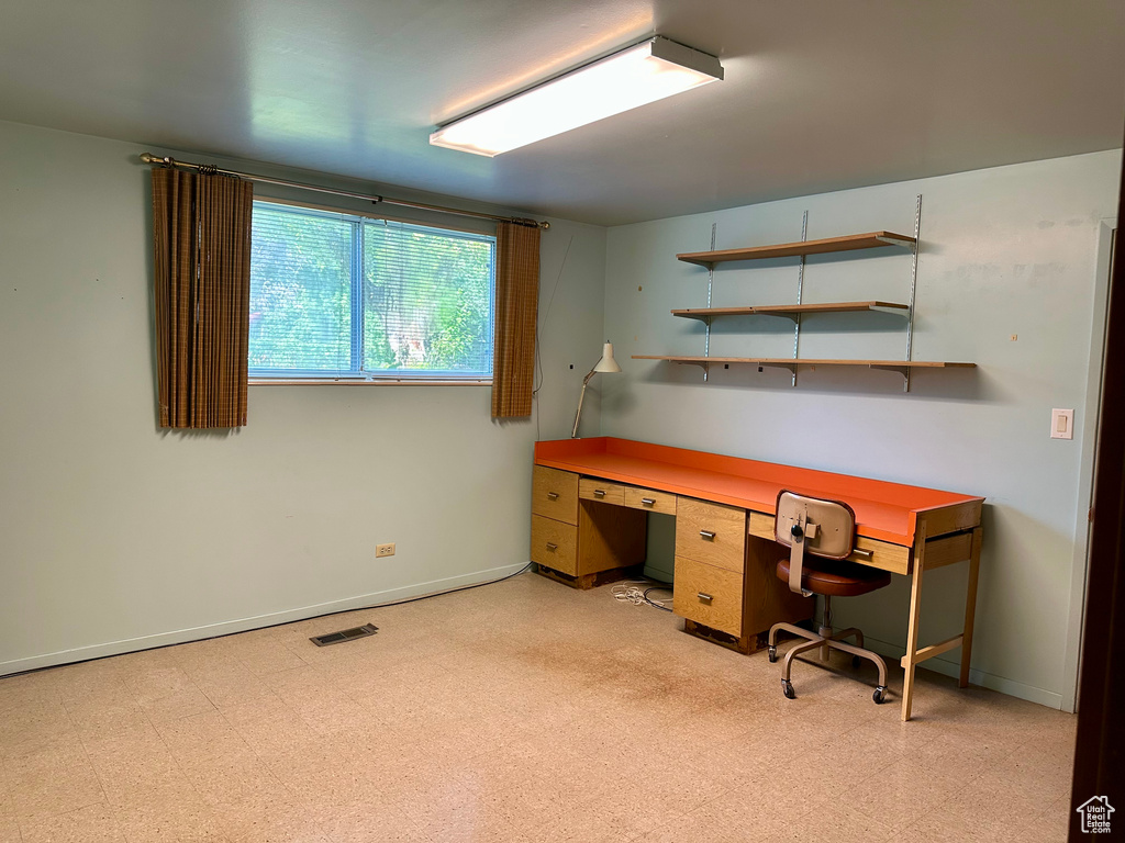 Office area with light floors and baseboards