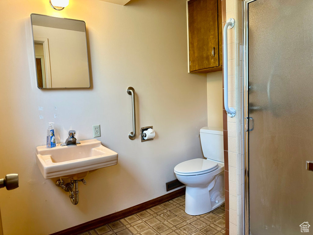Bathroom with toilet and a shower stall