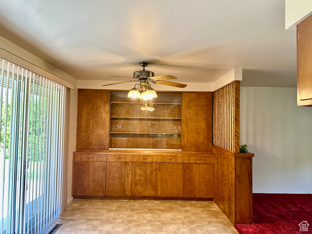 Unfurnished dining area with a ceiling fan