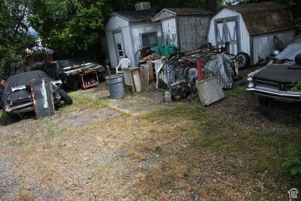 View of yard with a shed and an outdoor structure