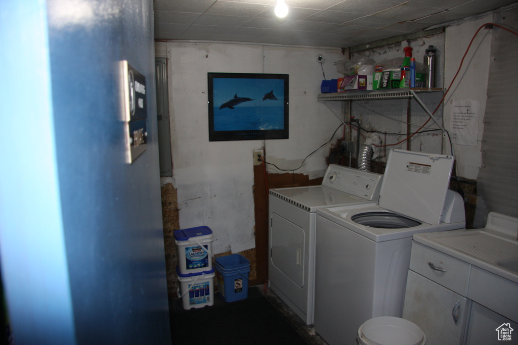 Clothes washing area with separate washer and dryer and cabinet space