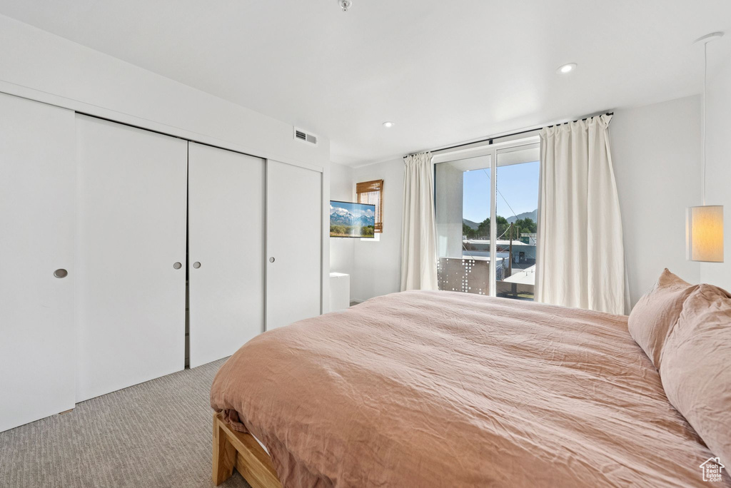 Bedroom featuring carpet, a closet, access to exterior, and recessed lighting