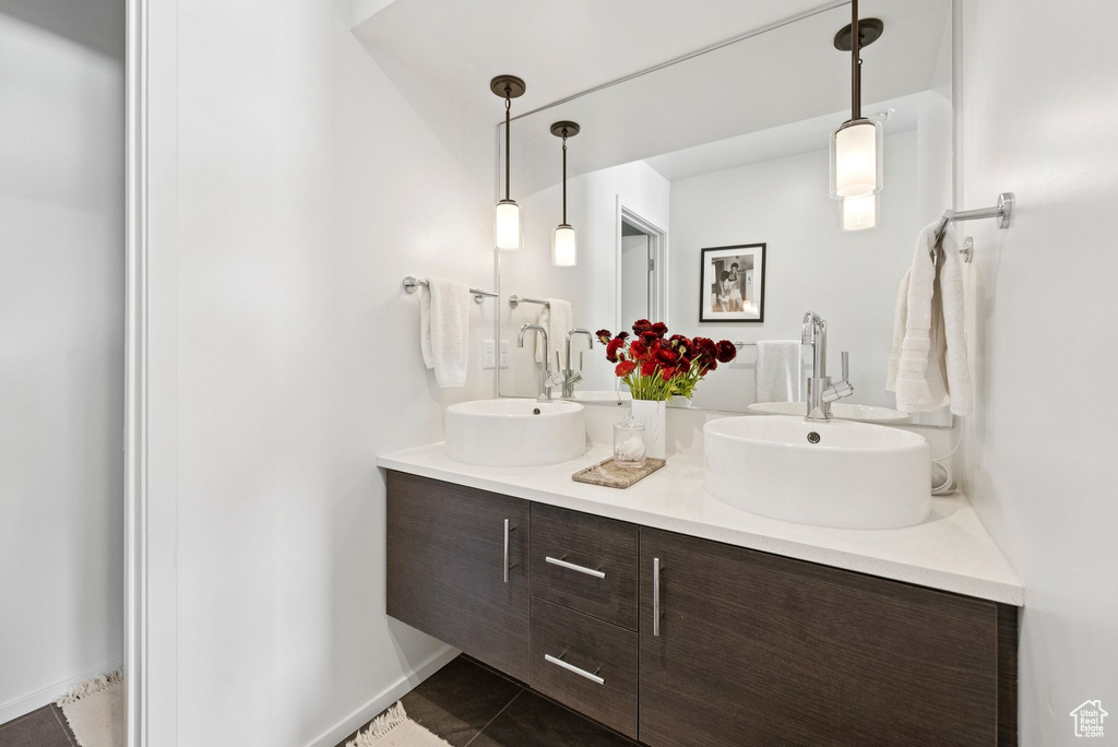 Full bathroom with double vanity and tile patterned floors