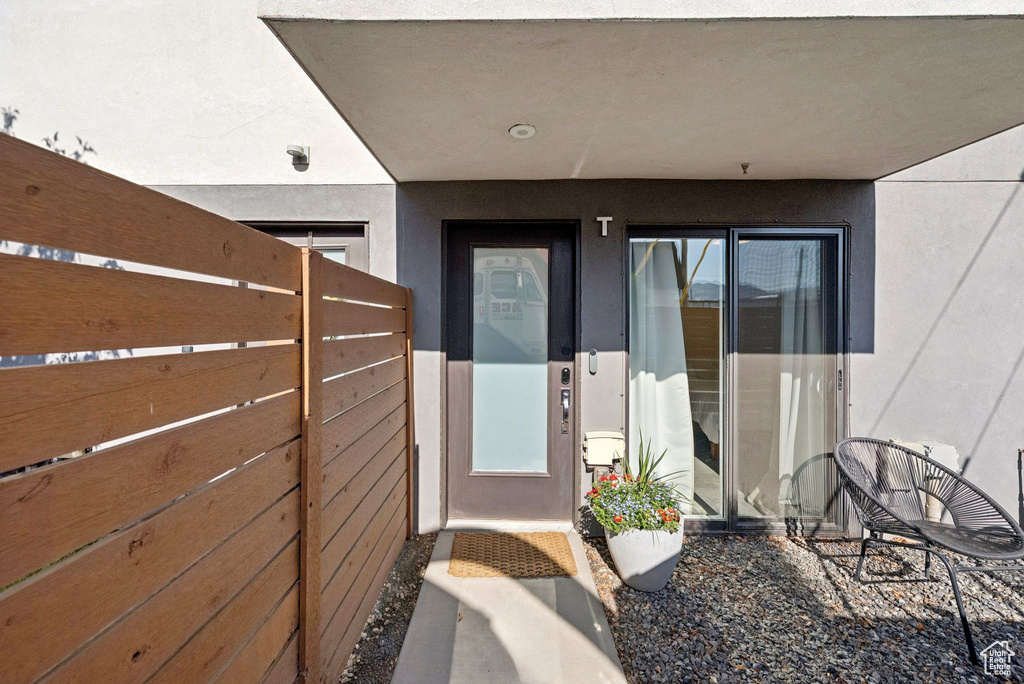 Property entrance with stucco siding