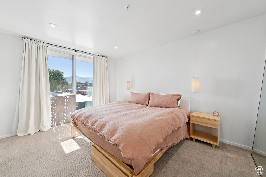 Bedroom featuring carpet, recessed lighting, and a mountain view