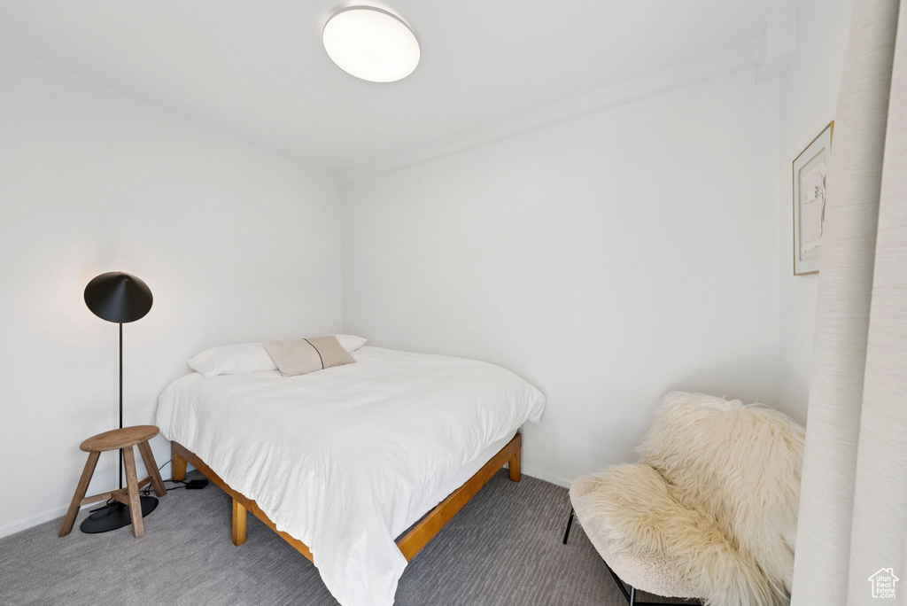 Carpeted bedroom with baseboards