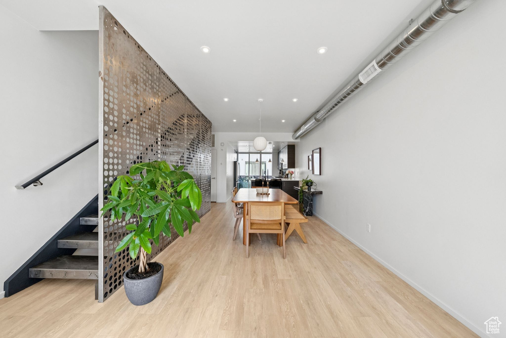 Dining room featuring wood finished floors and recessed lighting