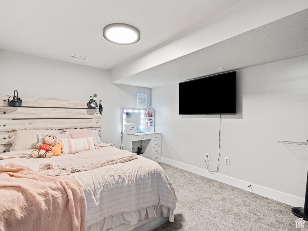 Bedroom with carpet and baseboards
