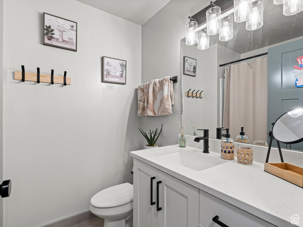 Bathroom with vanity and a shower with curtain