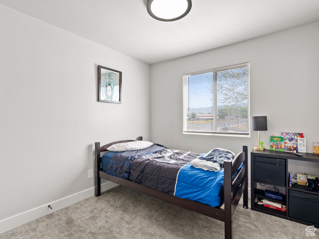 Bedroom featuring carpet flooring