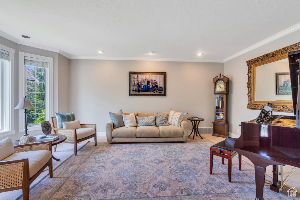 Living room featuring ornamental molding and recessed lighting