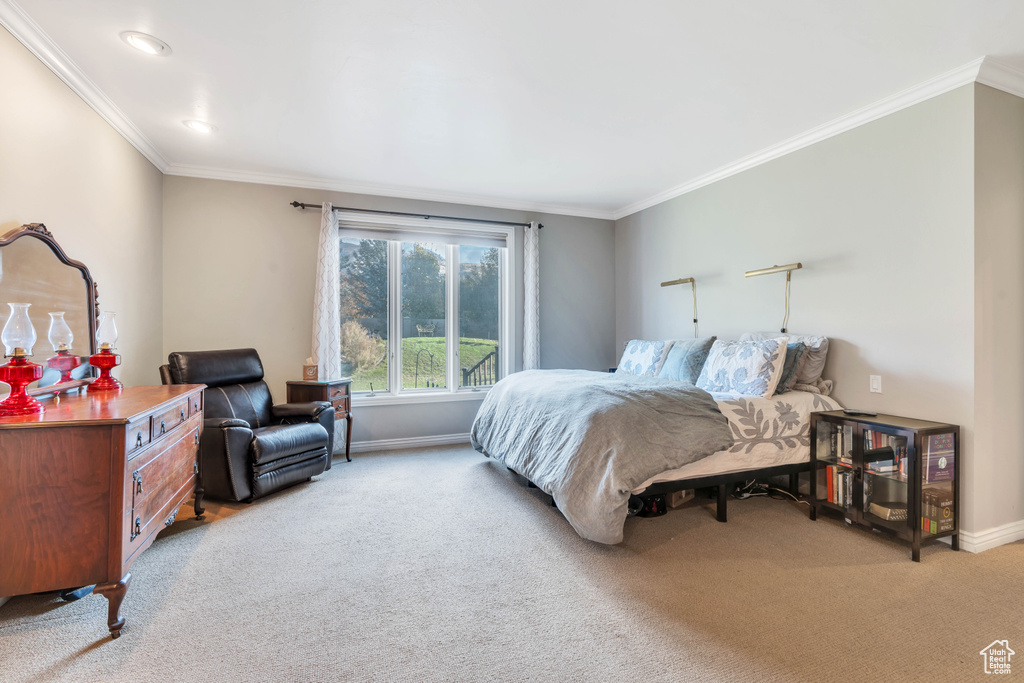 Bedroom featuring light carpet, ornamental molding, and recessed lighting