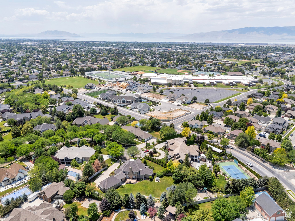 Aerial perspective of suburban area featuring a mountainous background