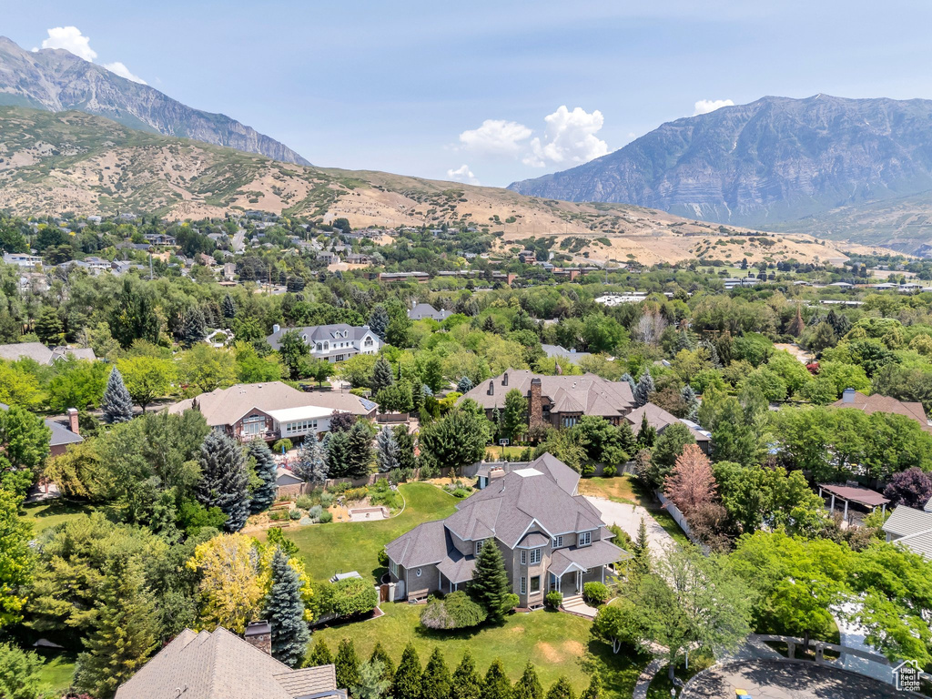 Aerial perspective of suburban area featuring a mountain backdrop