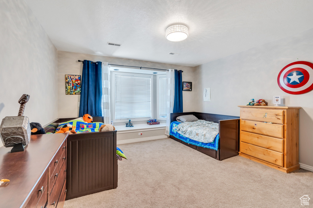 Bedroom with carpet flooring