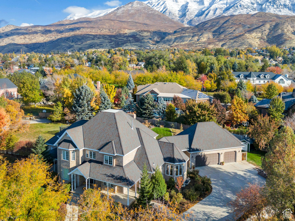 View of subject property with a mountain backdrop