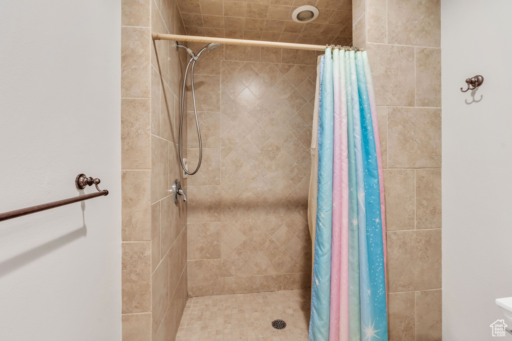 Full bathroom with a tile shower