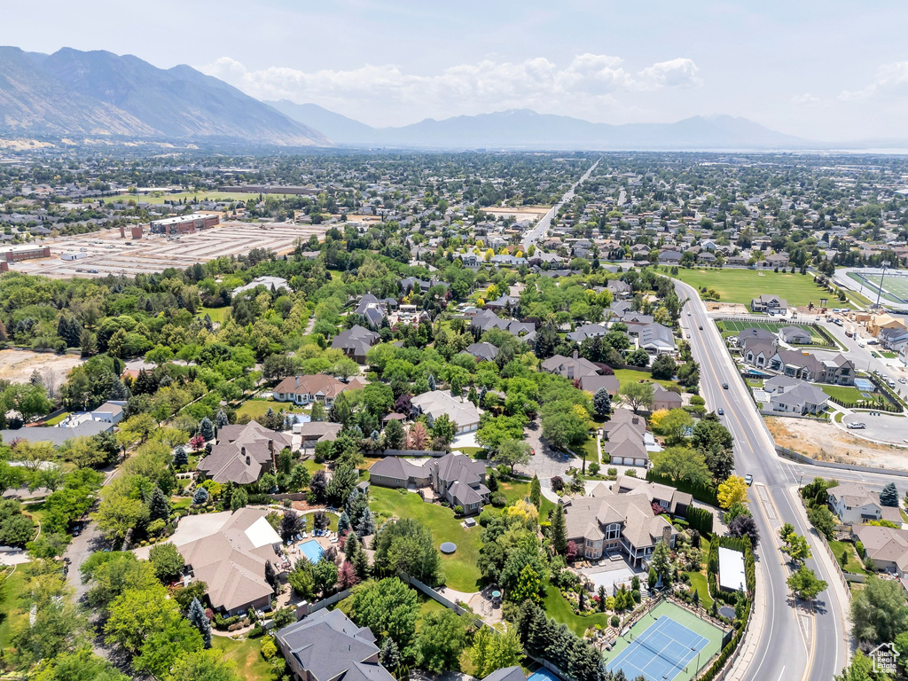 Aerial perspective of suburban area featuring a mountain backdrop