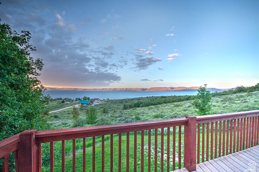 Wooden deck featuring a water view