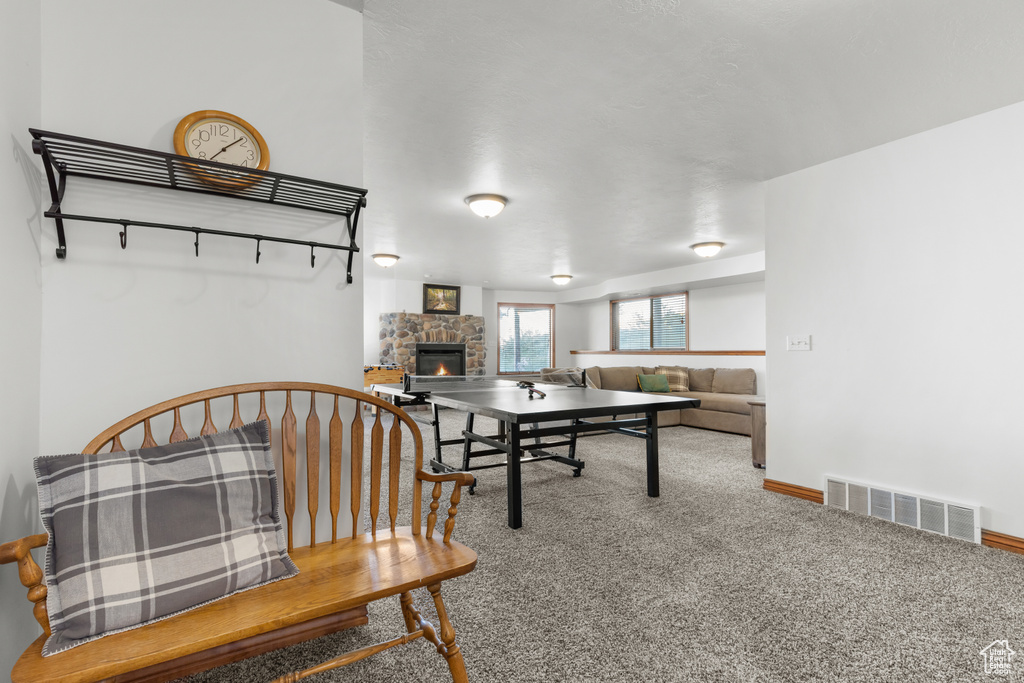 Playroom featuring a fireplace and carpet floors