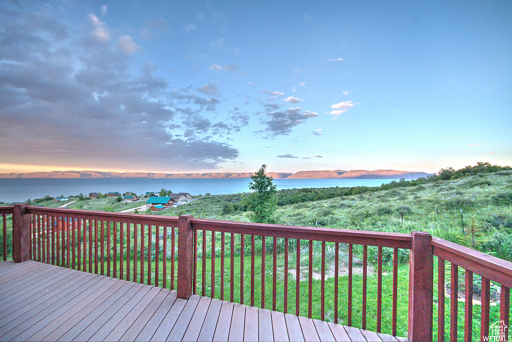 Wooden terrace featuring a water view