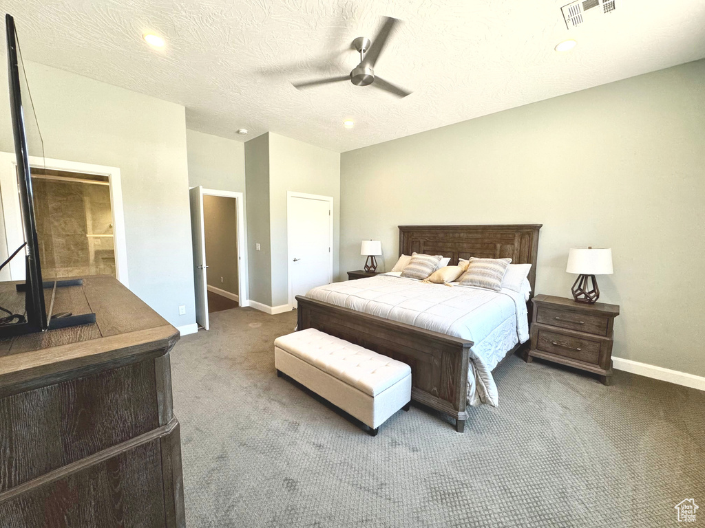 Bedroom featuring carpet, recessed lighting, ceiling fan, and a textured ceiling