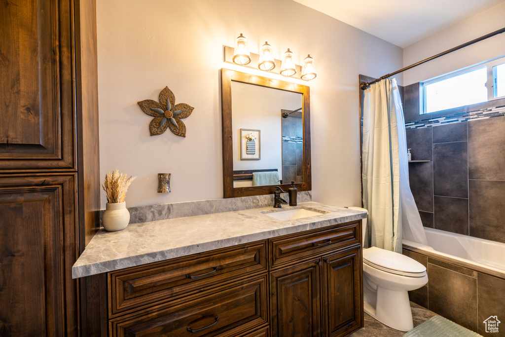 Bathroom featuring vanity and tiled shower / bath combo