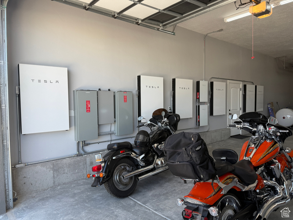 Garage featuring a garage door opener