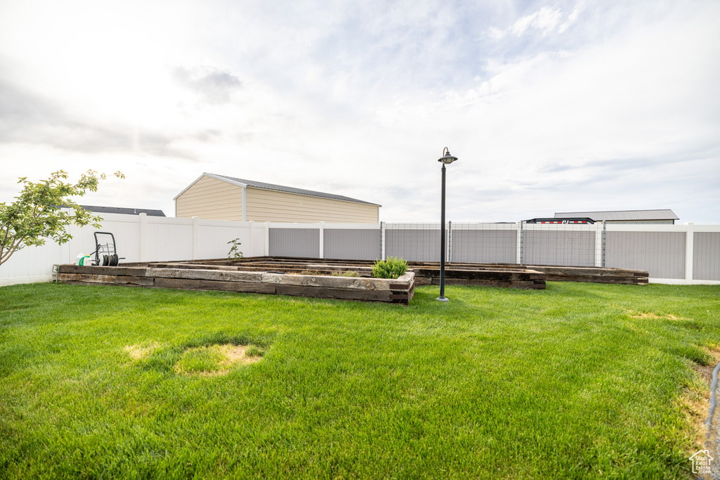 View of yard featuring a garden