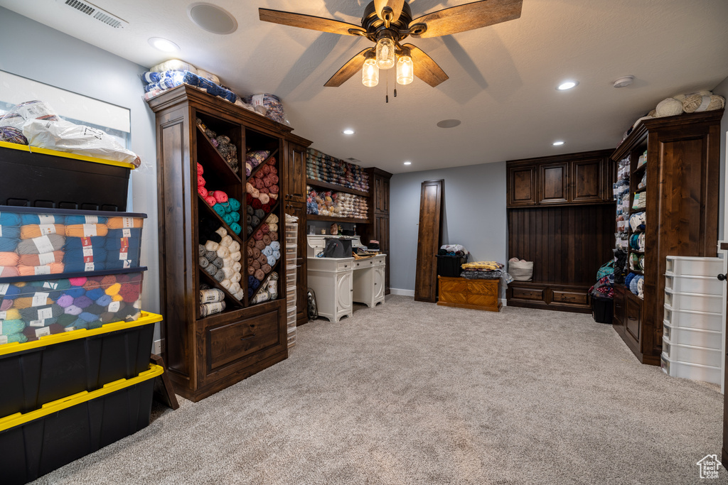 Bedroom with light colored carpet, recessed lighting, and ceiling fan