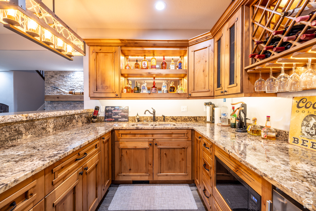 Indoor wet bar with built in microwave, pendant lighting, and recessed lighting