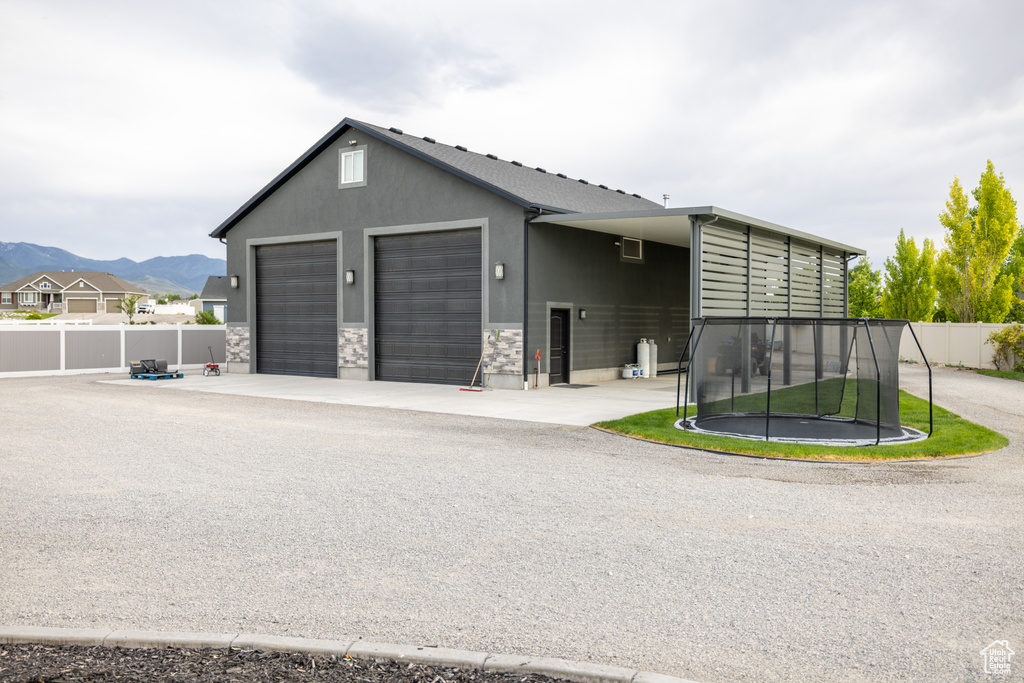 Garage with a trampoline and a mountain view