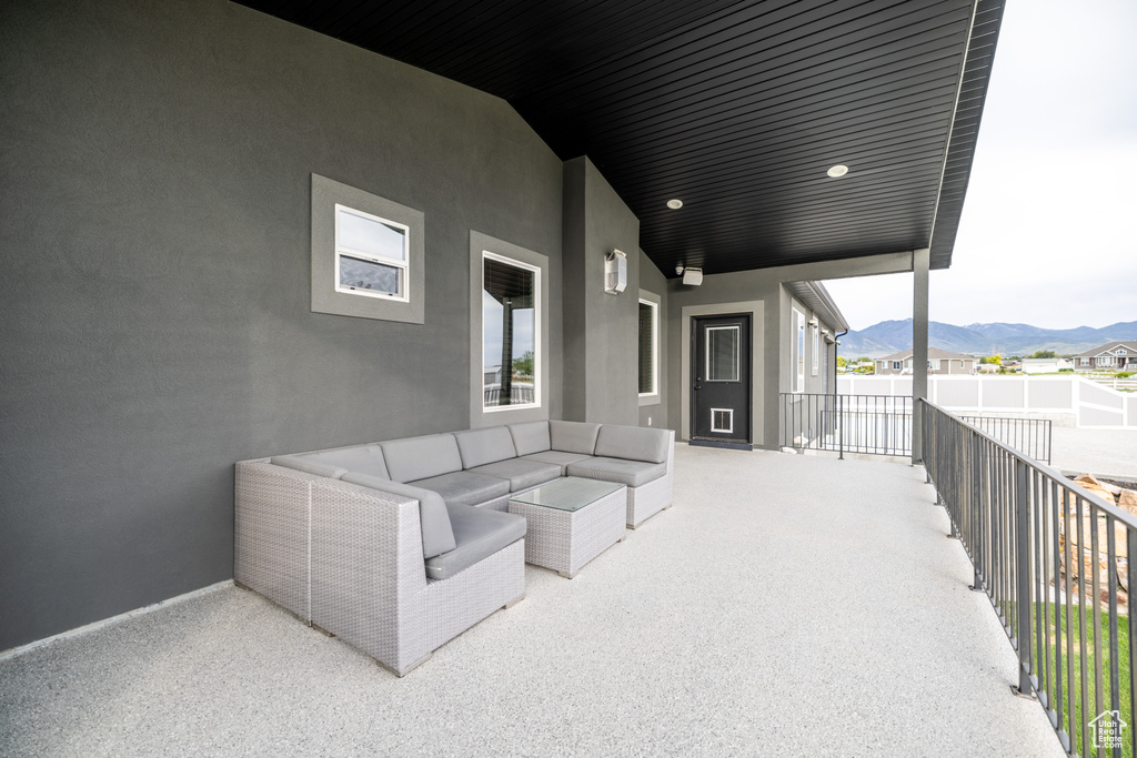 View of patio / terrace featuring a mountain view and an outdoor living space