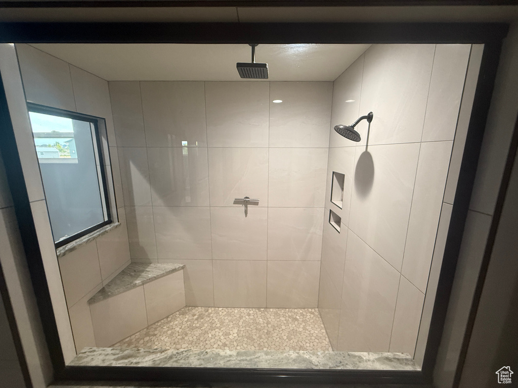 Bathroom with tiled shower