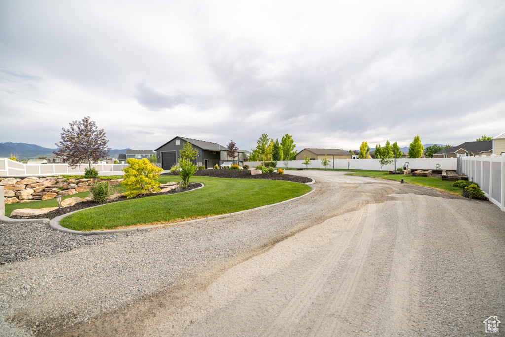 View of asphalt road with a residential view