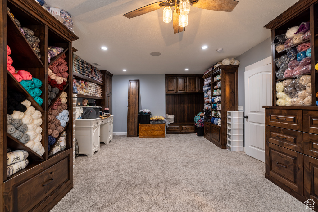 Office space featuring light colored carpet, a ceiling fan, and recessed lighting