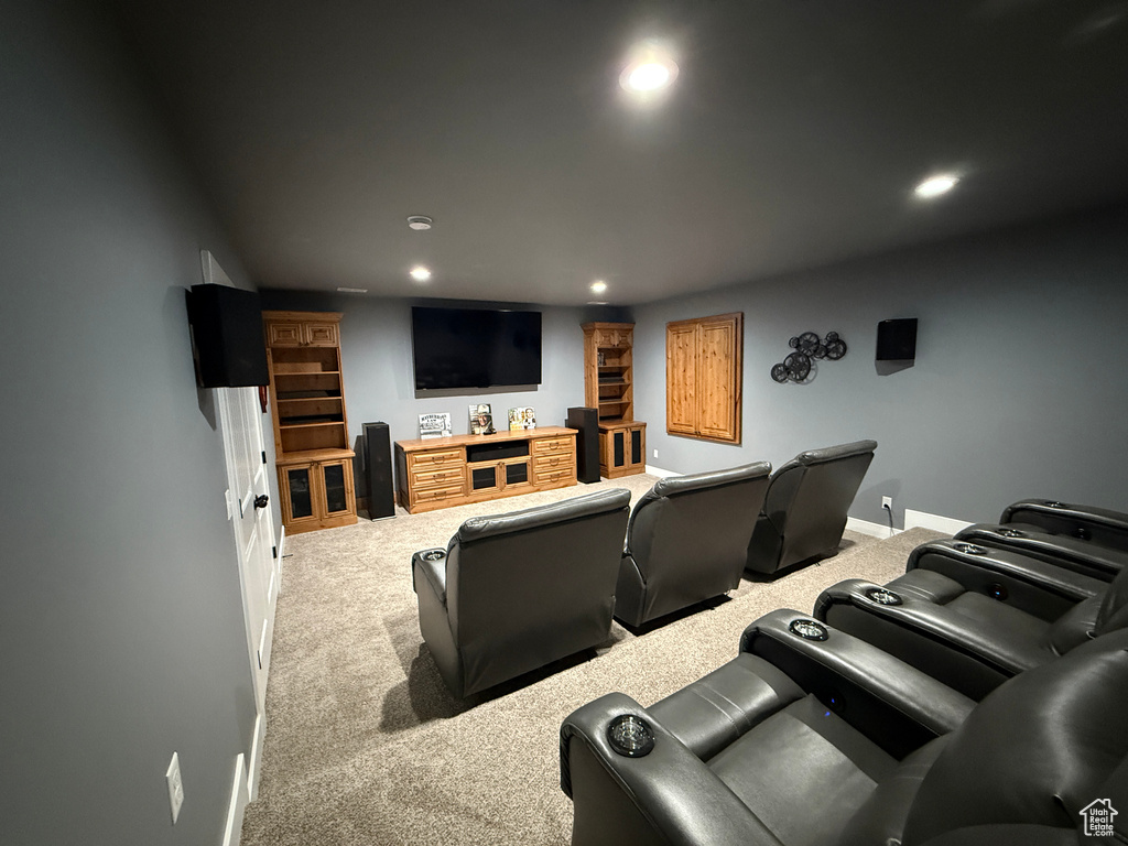 Home theater room with carpet and recessed lighting