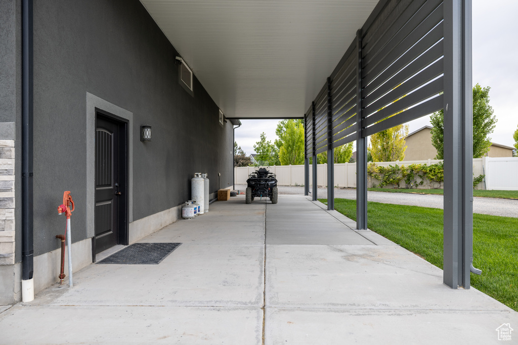 View of patio / terrace with a carport