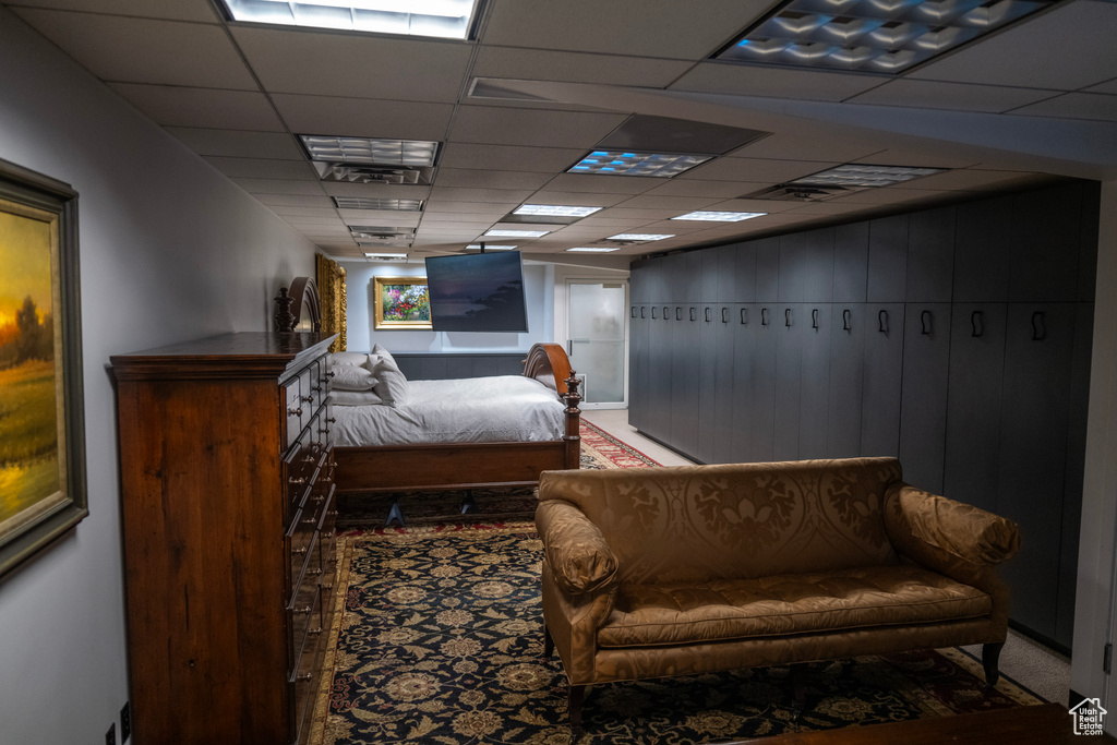 Bedroom with a paneled ceiling