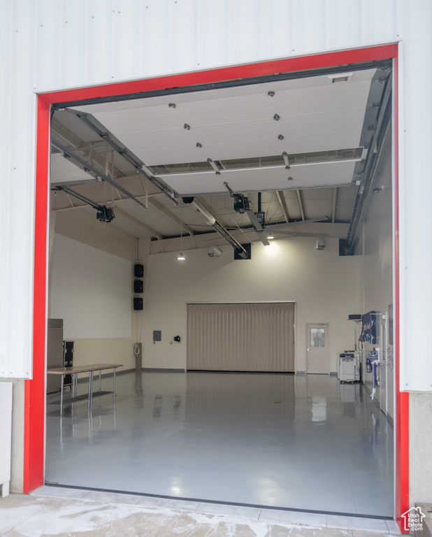 Garage featuring a garage door opener