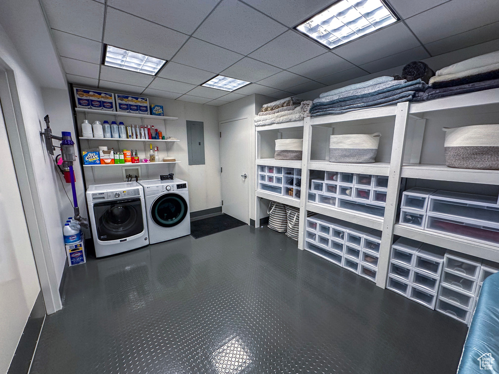 Washroom featuring independent washer and dryer and electric panel